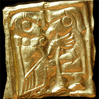 Bild av guldgubbe, guldfoliefigur